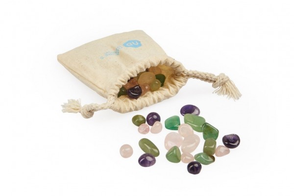 image of bag form which spill forth therapeutic gemstones of rose quartx, green aventurine and clear quartz rock crystal