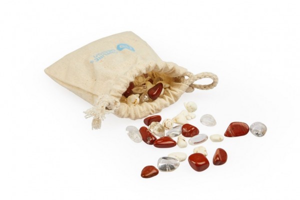 image of bag form which spill forth therapeutic gemstones magnetite, red jaspere and clear quartz rock crystal for sustained activity and maximum performance in any sport